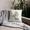 Japandi style decorative pillow with minimalist sage green bonsai tree illustration on off-white cushion cover, modern calm living room decor